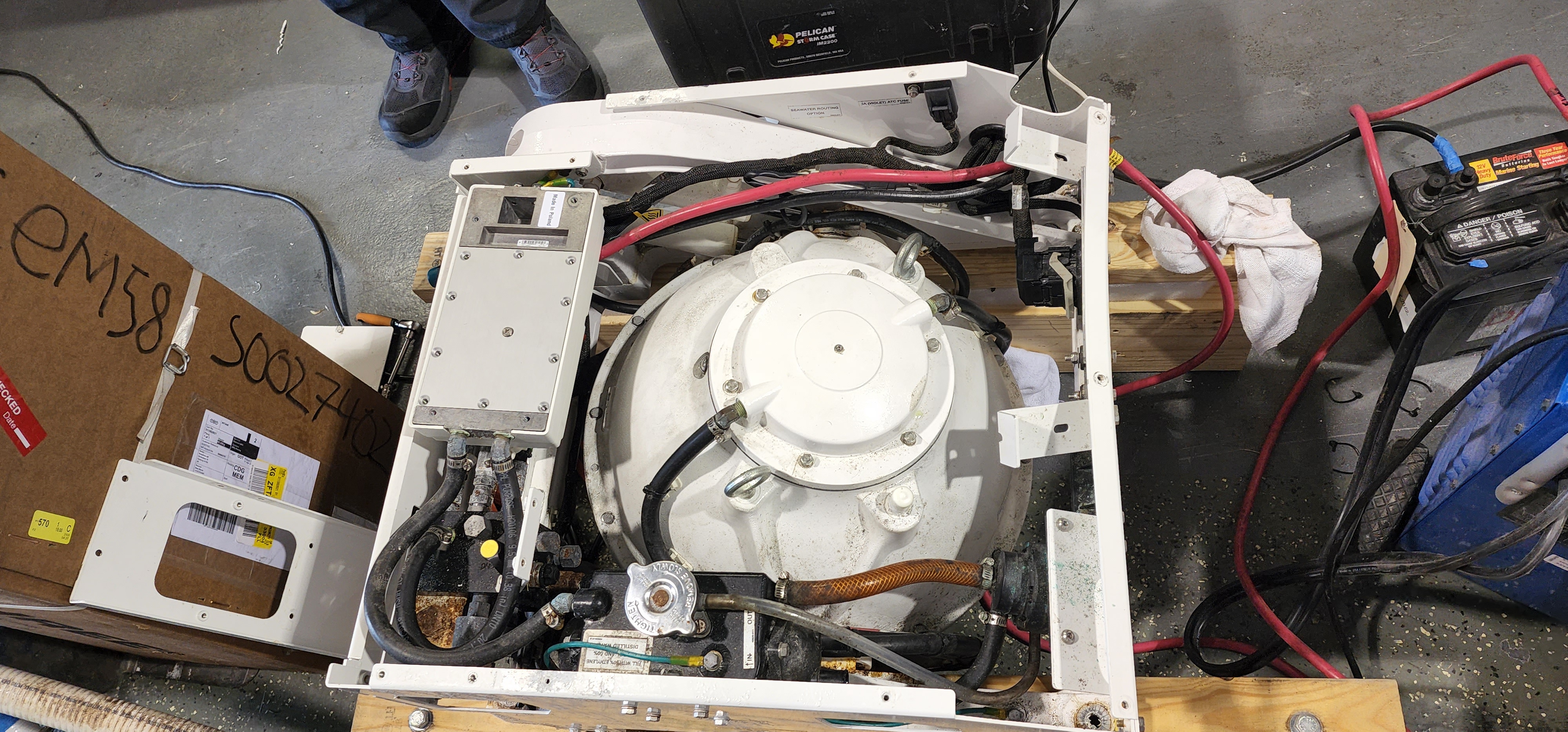 Removed Seakeeper SK2 unit on pallet with serial number visible — removed at under 21 months
